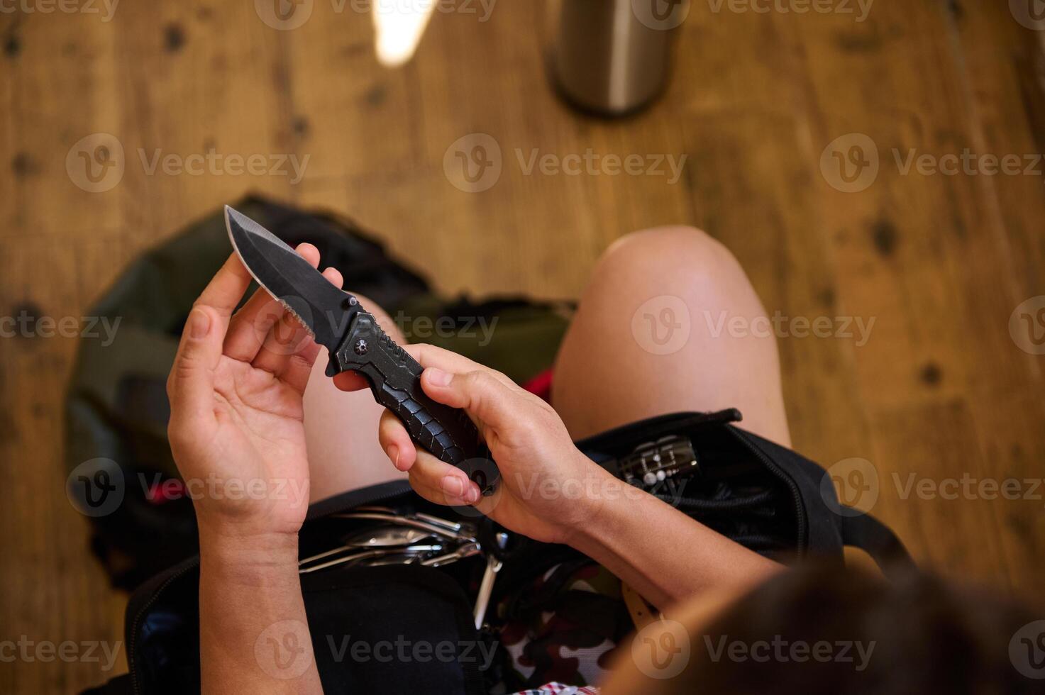 Person Holding Tactical Knife photo