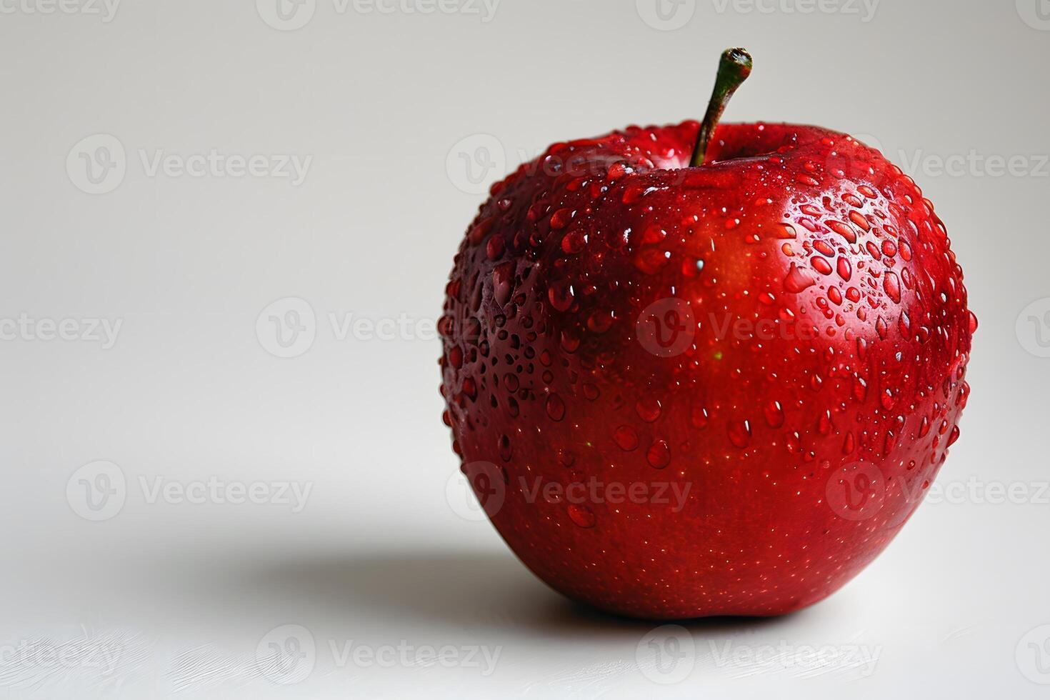 Fresh Red Apple with Water Droplets on White Background - Ideal for Healthy Eating Concepts and Food Photography photo