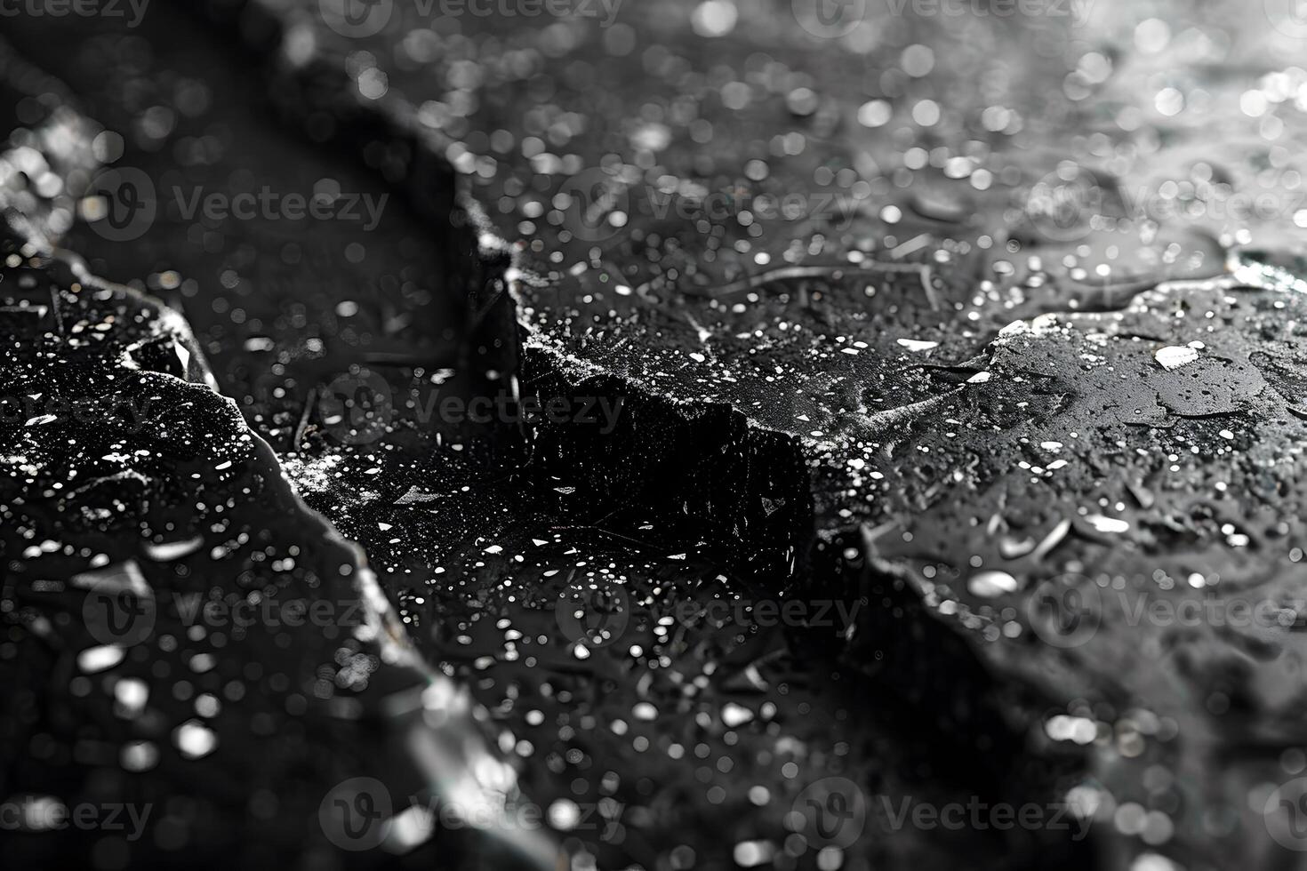 Cracked Black Surface with Shiny Particles and Water Droplets - Textured Background for Print, Poster Design photo