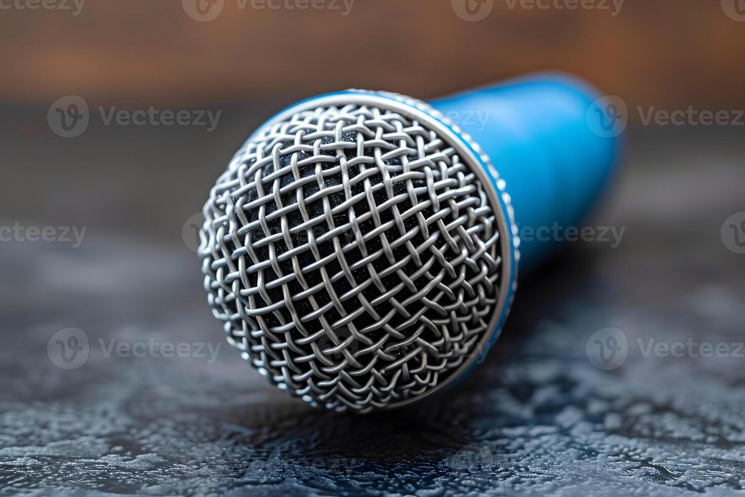 Close-Up of Blue Microphone on Textured Surface for Audio and Music Production photo