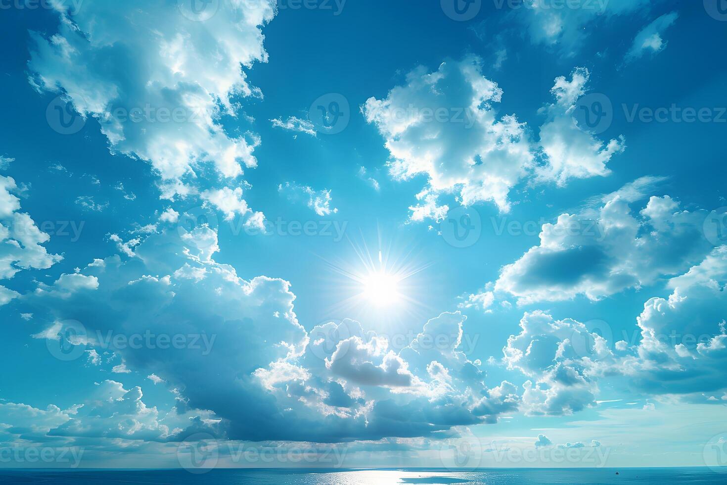 Tranquil Ocean Horizon with Sunburst and Fluffy Clouds photo