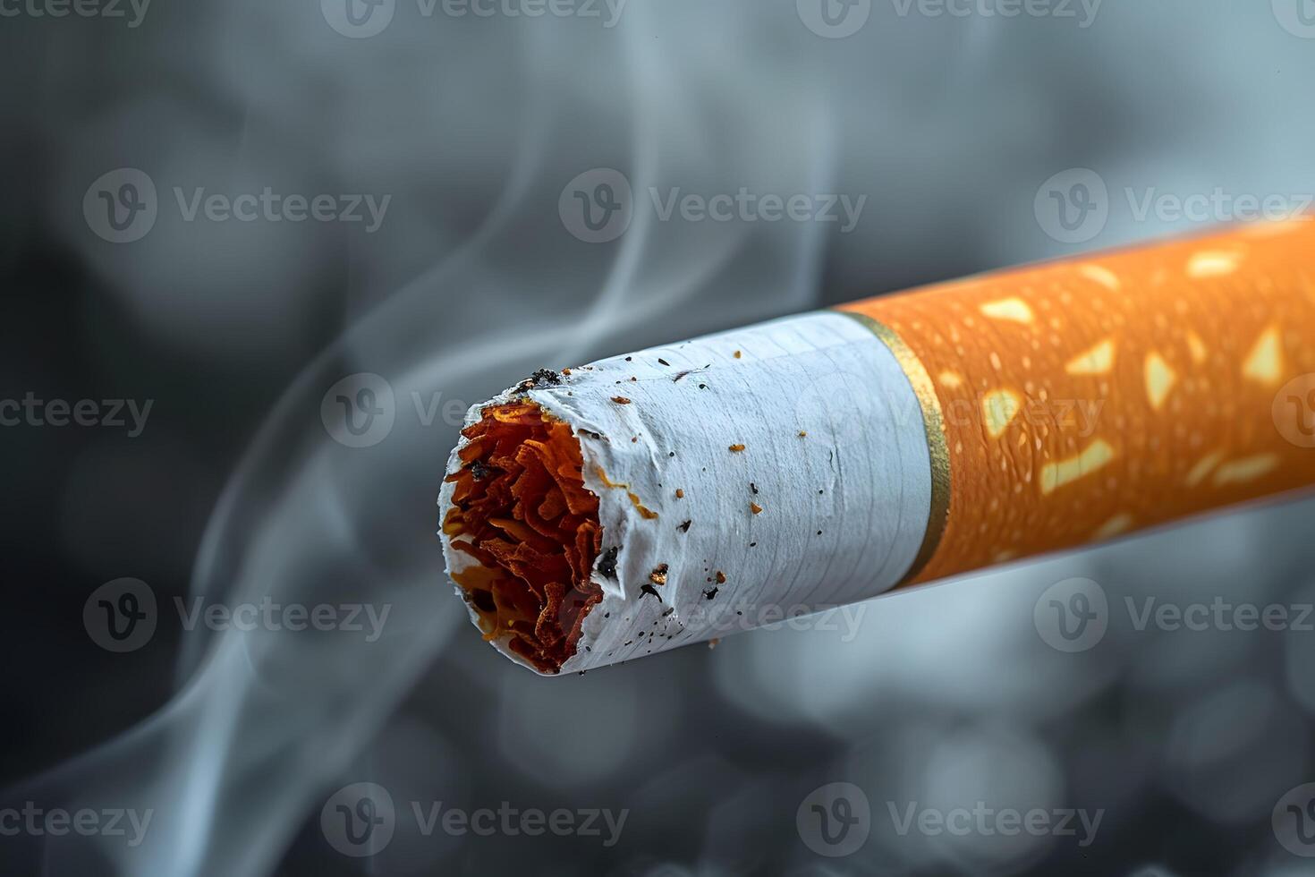 Close-Up of a Smoking Cigarette with Ash and Smoke in Focus photo