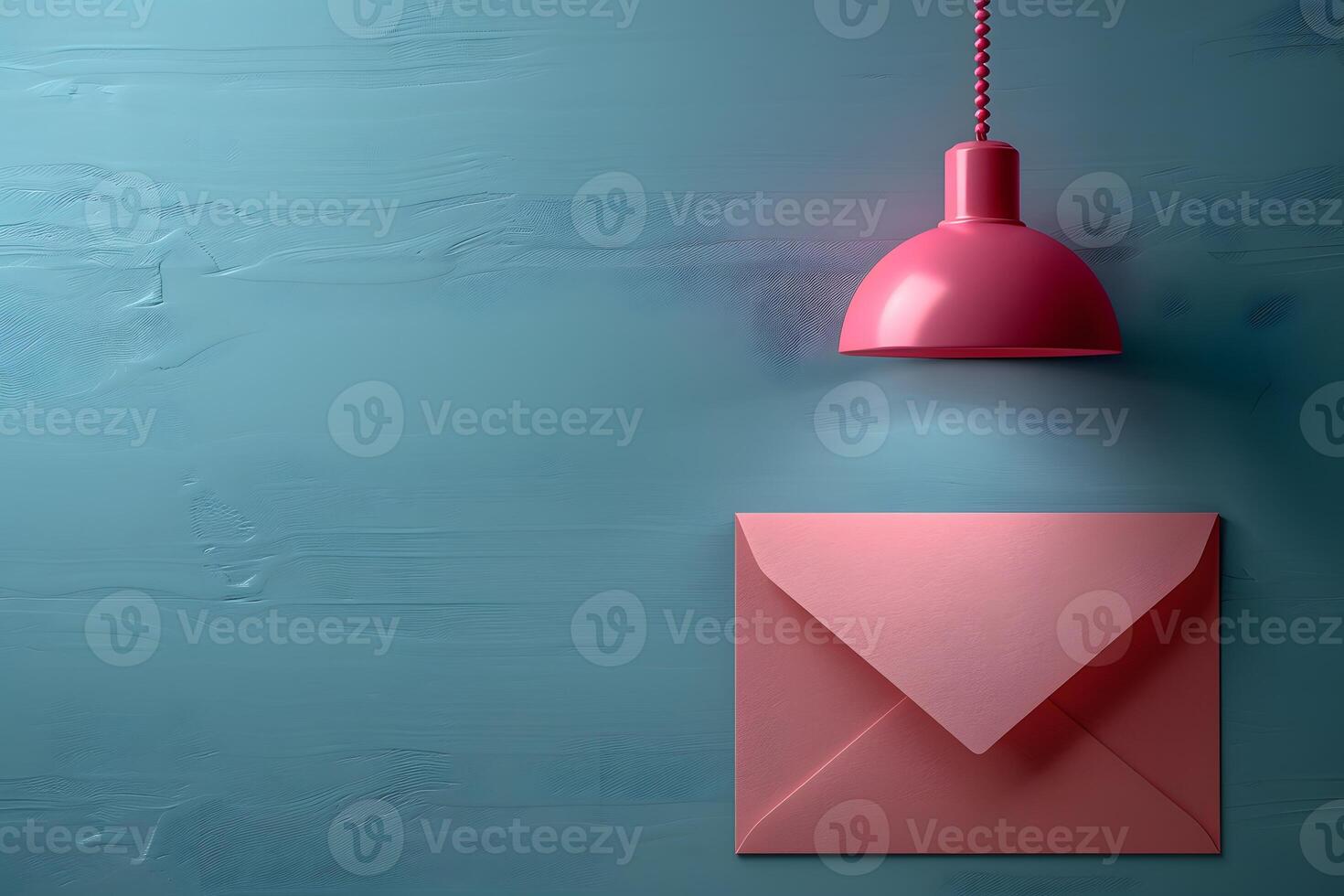 Minimalistic Pink Envelope with Pendant Light Against Blue Background for Creative Design photo