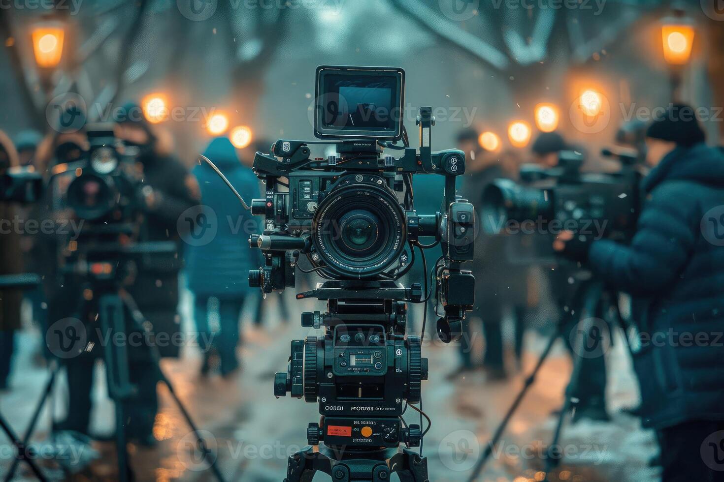 A Professional Film Camera Set Up In The Snow With Bokeh Lights photo
