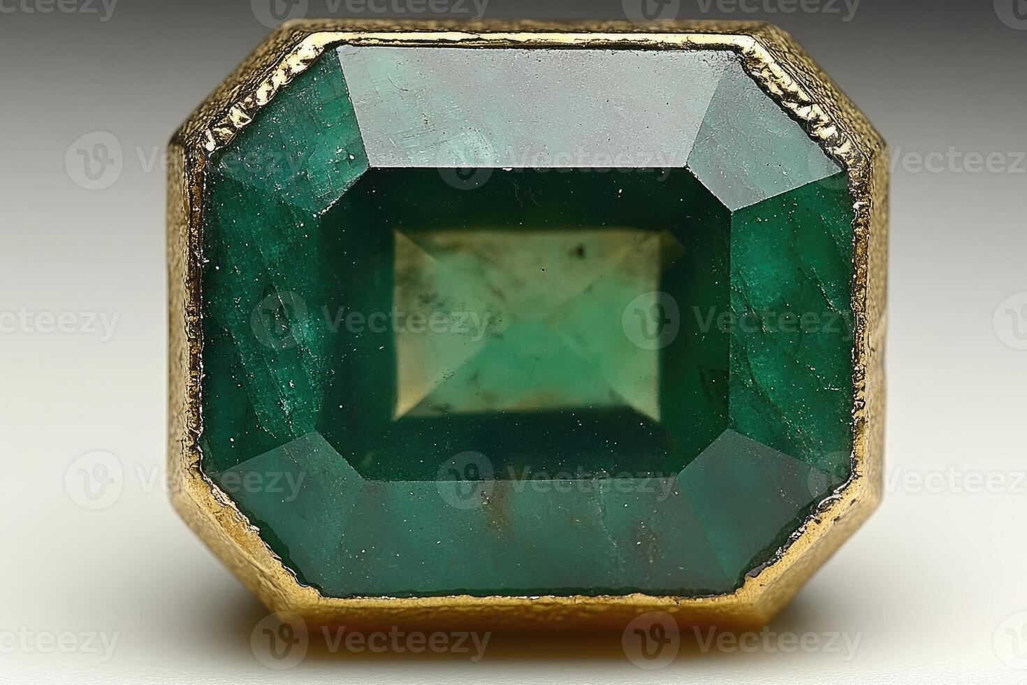 A Close-Up View of a Large Emerald Gemstone Set in Gold photo