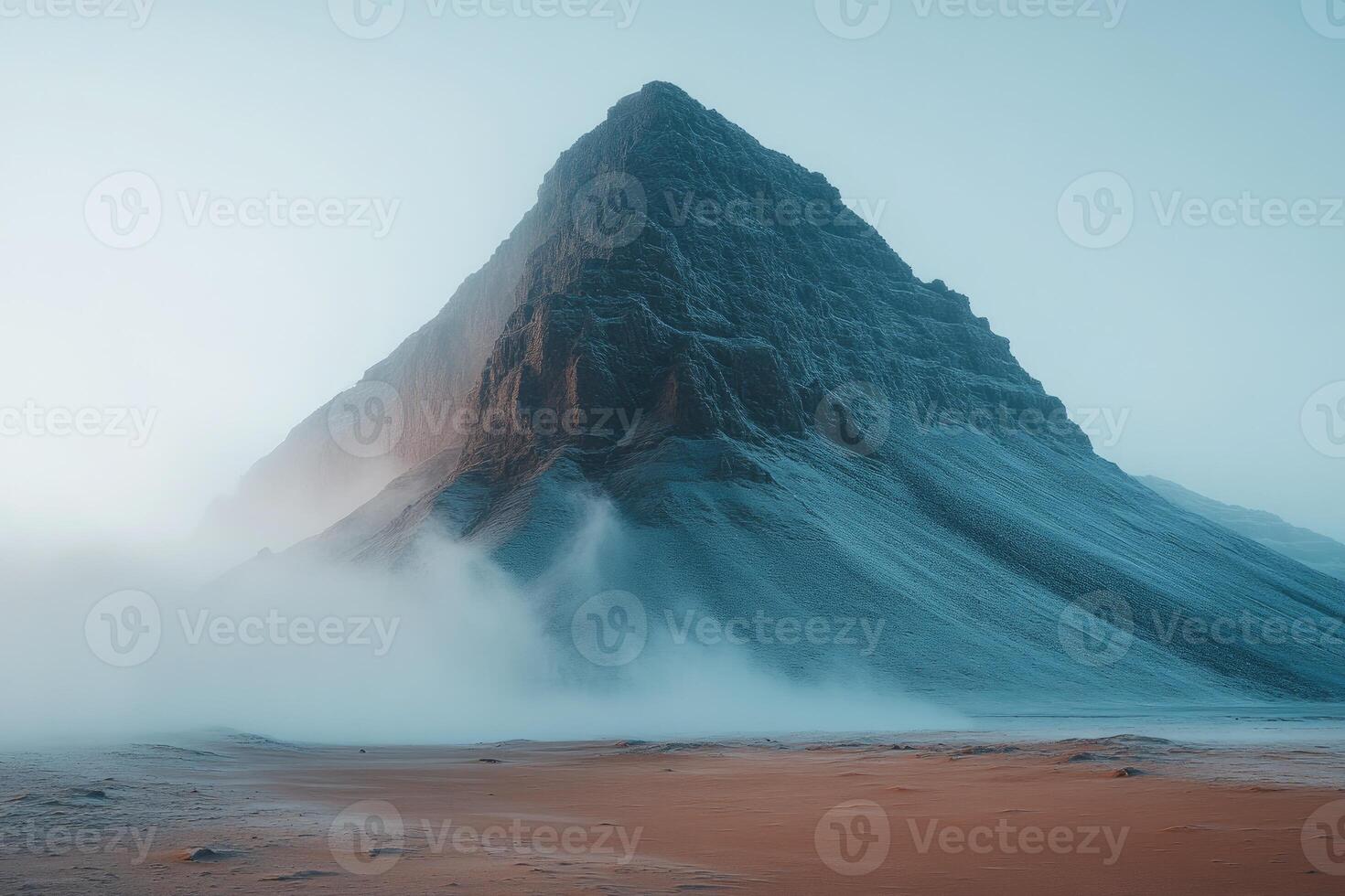 A Majestic Mountain Peak Rising Through Mist photo