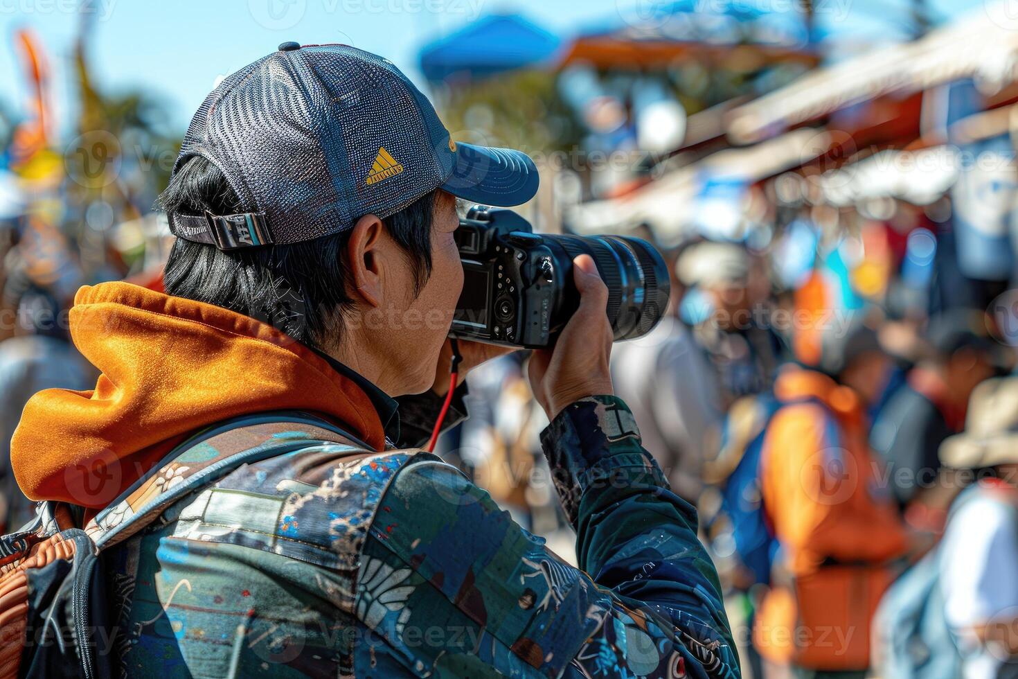 A Photographer Capturing a Moment in a Crowd photo