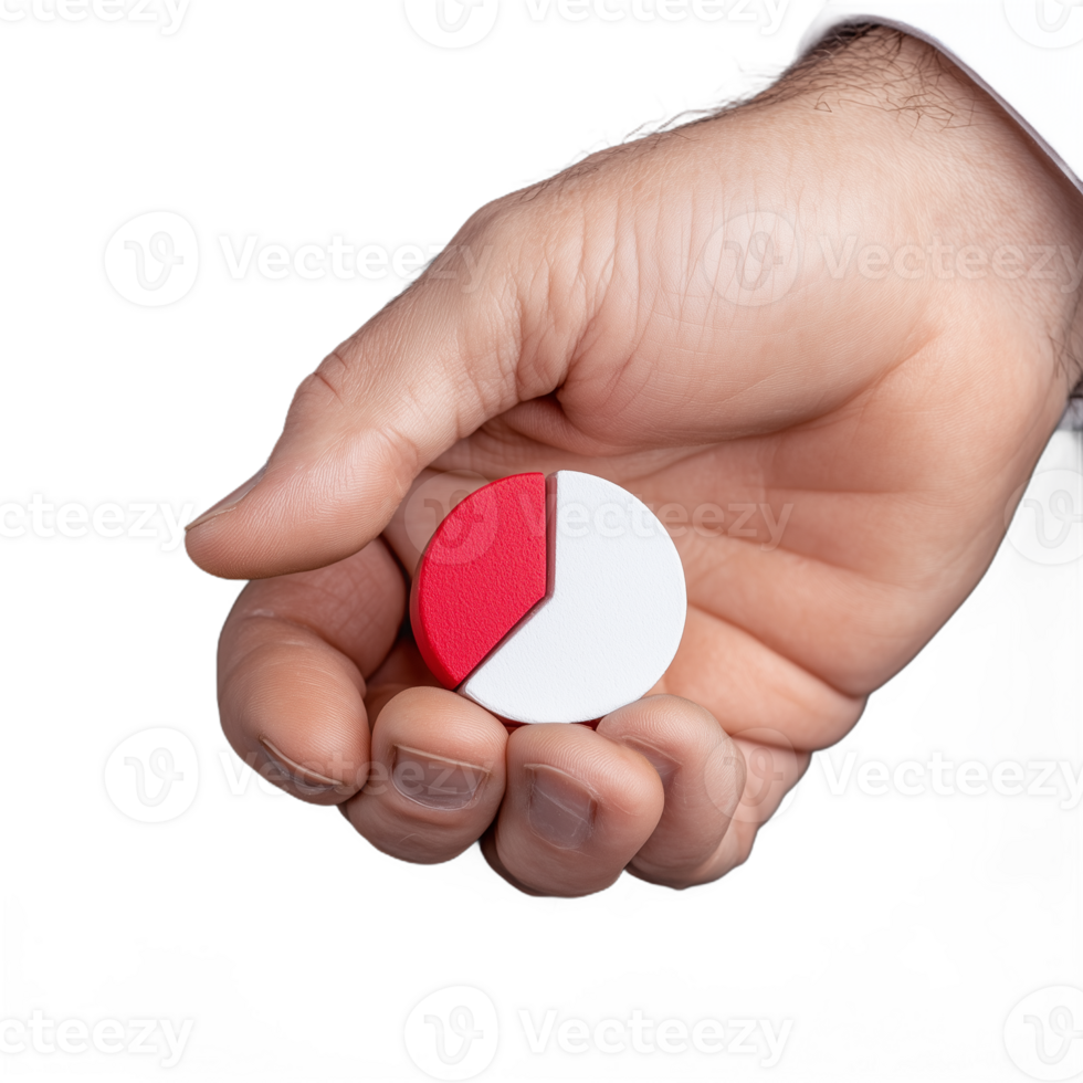 Close-up of a hand holding a small red and white pie chart segment on a transparent background png