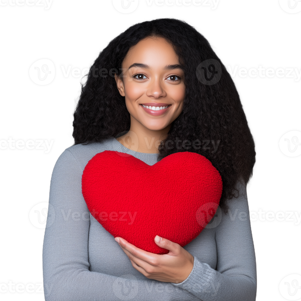 Smiling woman holding a red heart-shaped cushion on a transparent background, symbolizing love and affection. Ideal for Valentine's Day themes, heartfelt messages, or concepts of happiness and joy. png