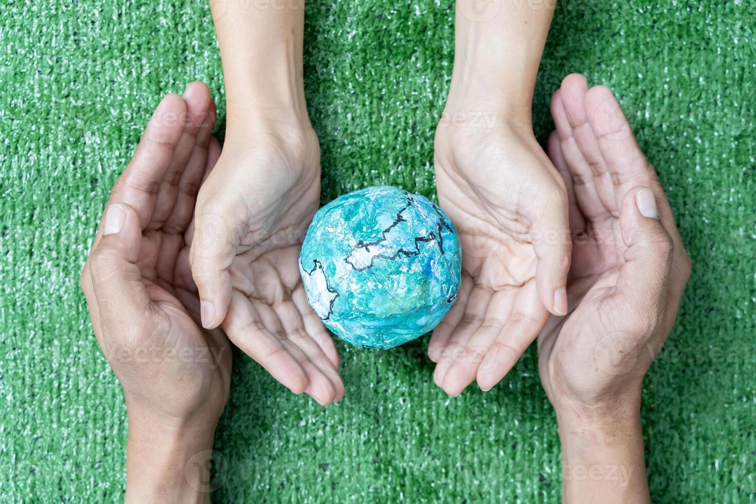Environment Earth Day In the hands holding green earth on Bokeh green Background, Saving environment, and environmentally sustainable. photo
