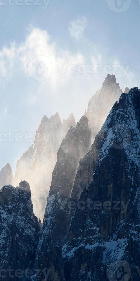 A mountain range with snow on it photo