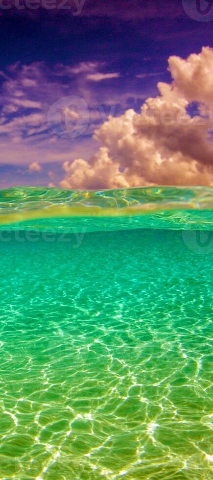 A beautiful blue sky with clouds and a beautiful ocean photo