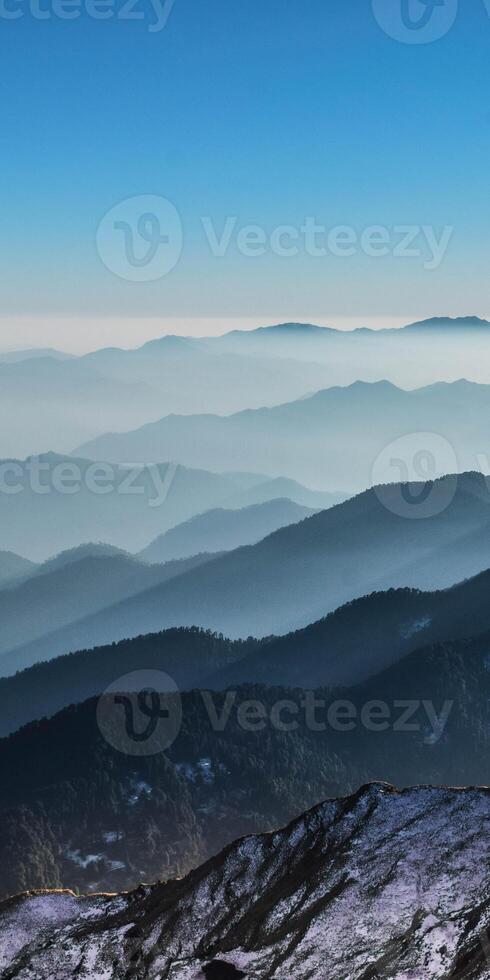 A view of the mountains from a mountain top photo
