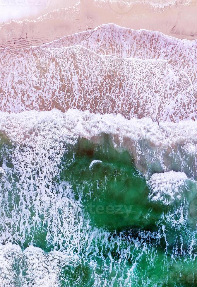 An aerial view of the ocean and waves photo