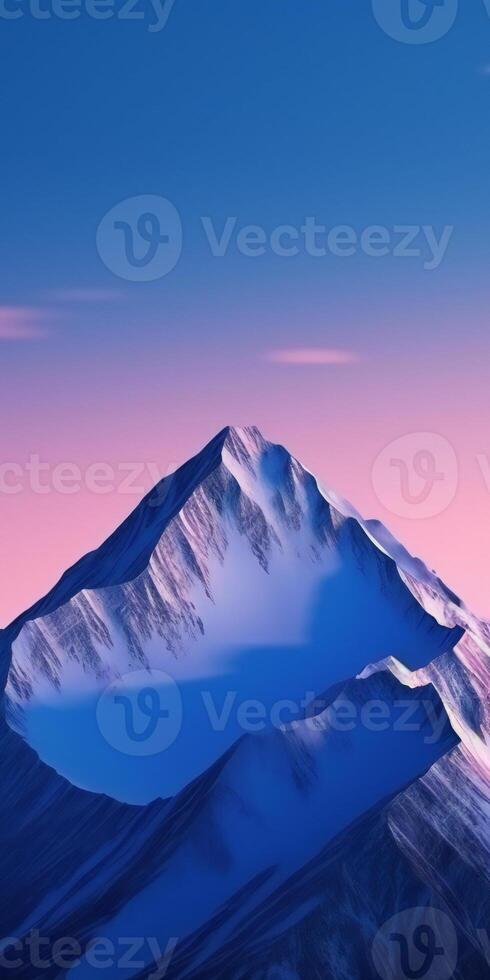 A mountain range with a pink sky and blue clouds photo