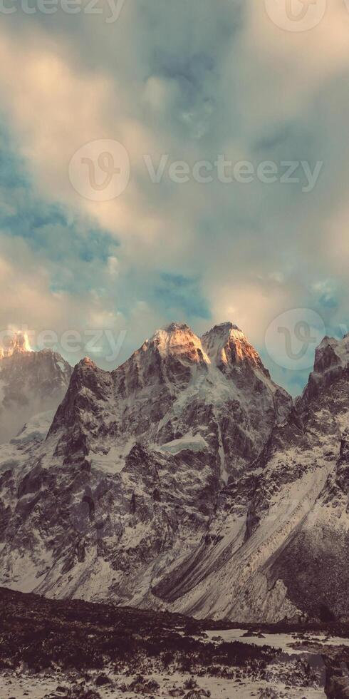 A mountain range with snow on the top photo