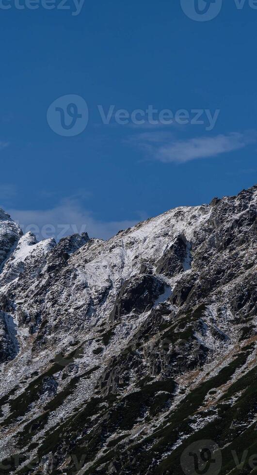 A mountain with snow on it photo