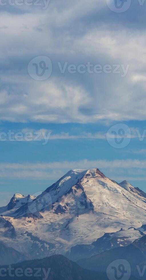 A mountain with snow on it photo