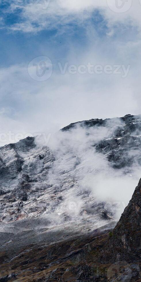 A large mountain with a small mountain on top photo