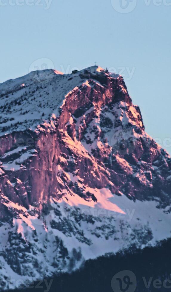 A mountain covered in snow photo