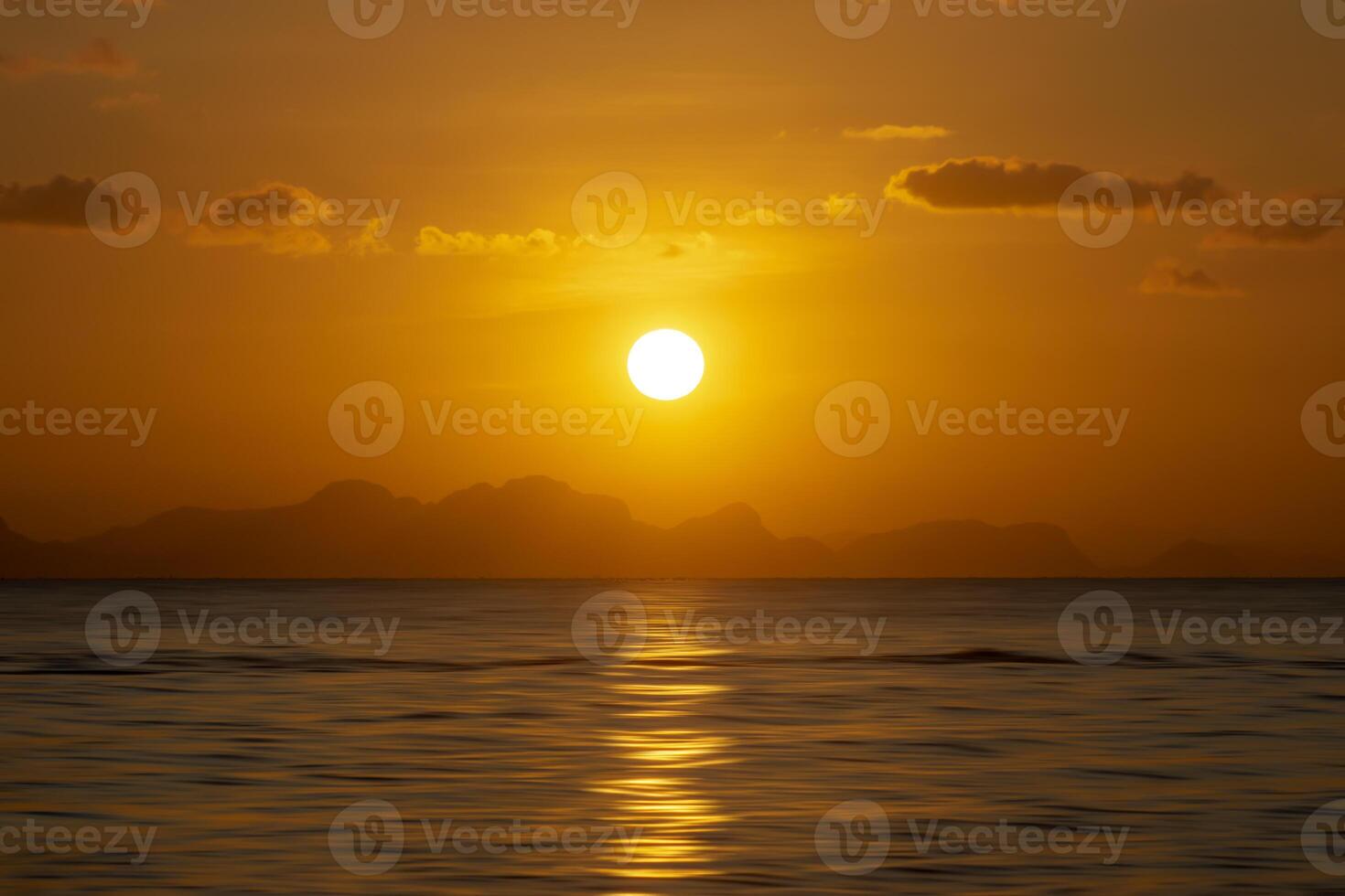 Sunset sky at the lake with dark clouds photo