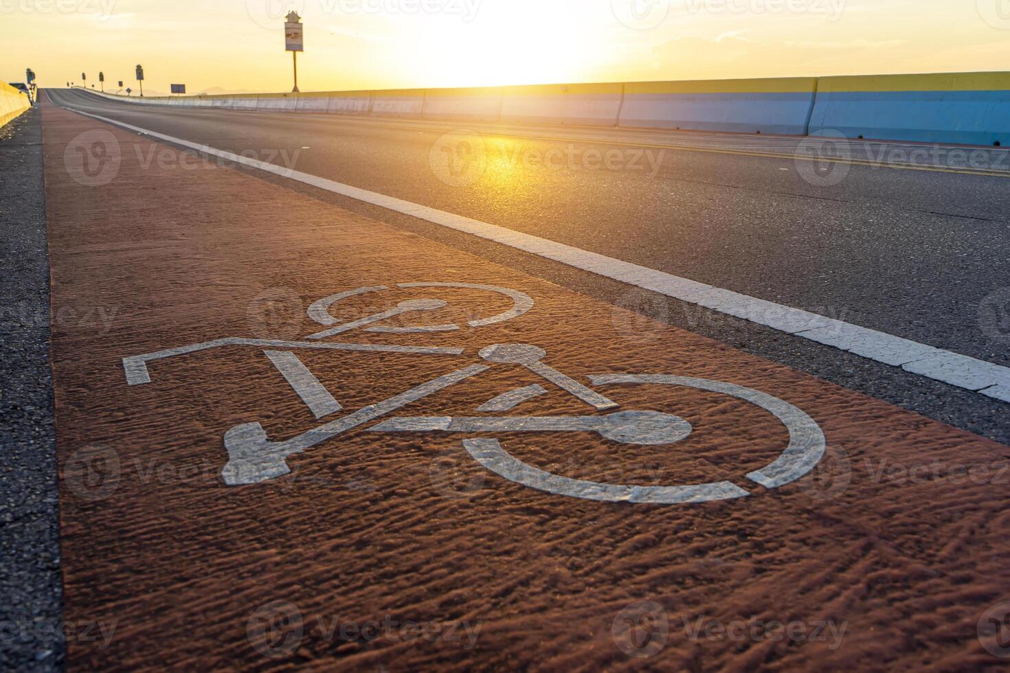 Abstract Bicycle icon on the road with sunlight. photo