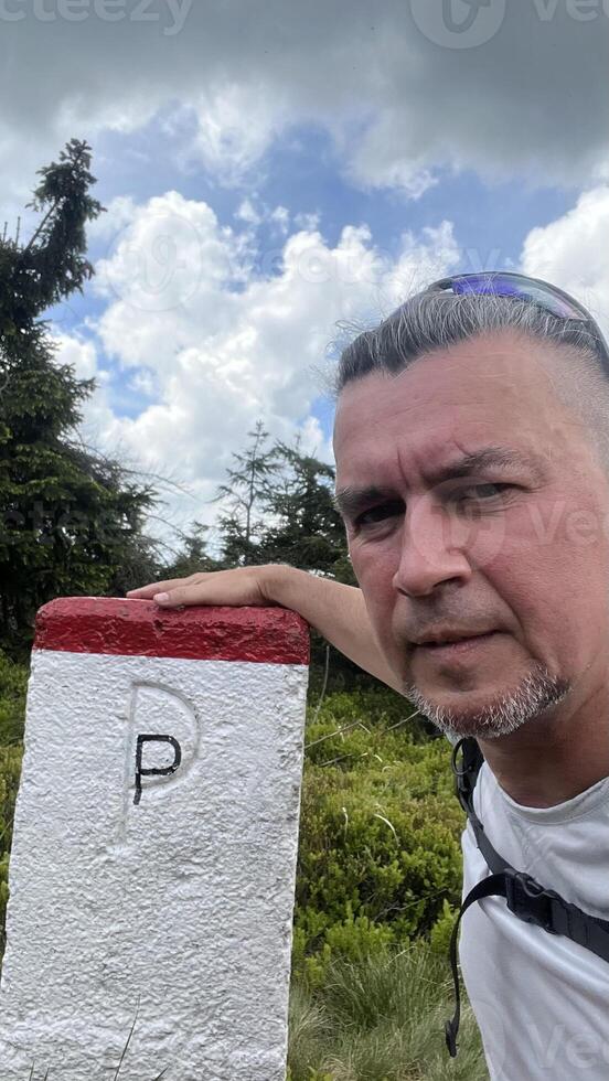 Border post between the Republic of Poland and the Czech Republic. Man on the border photo