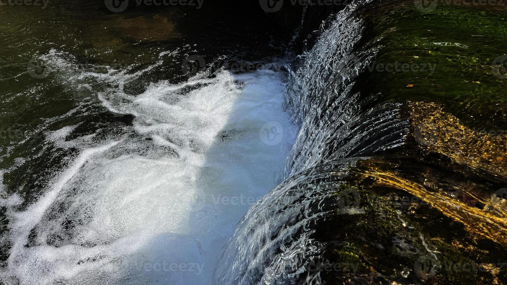 A small mountain river with a flow of water in the Polish mountains. Eastern Sudetes photo