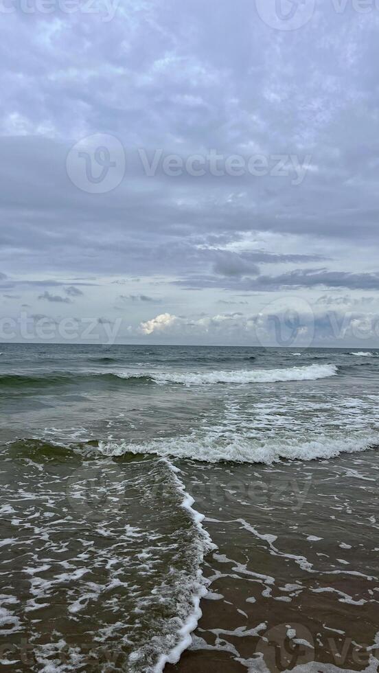 Waves rolling on the Baltic Sea coast. Seascape. Latvia photo