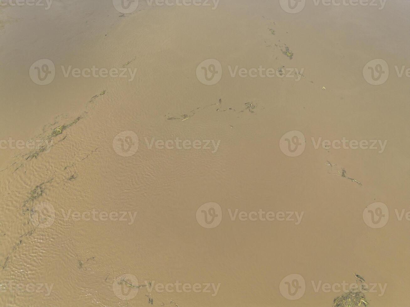 Mudflow of water in the Oder River of brown color. Poland. View from above. Background. photo