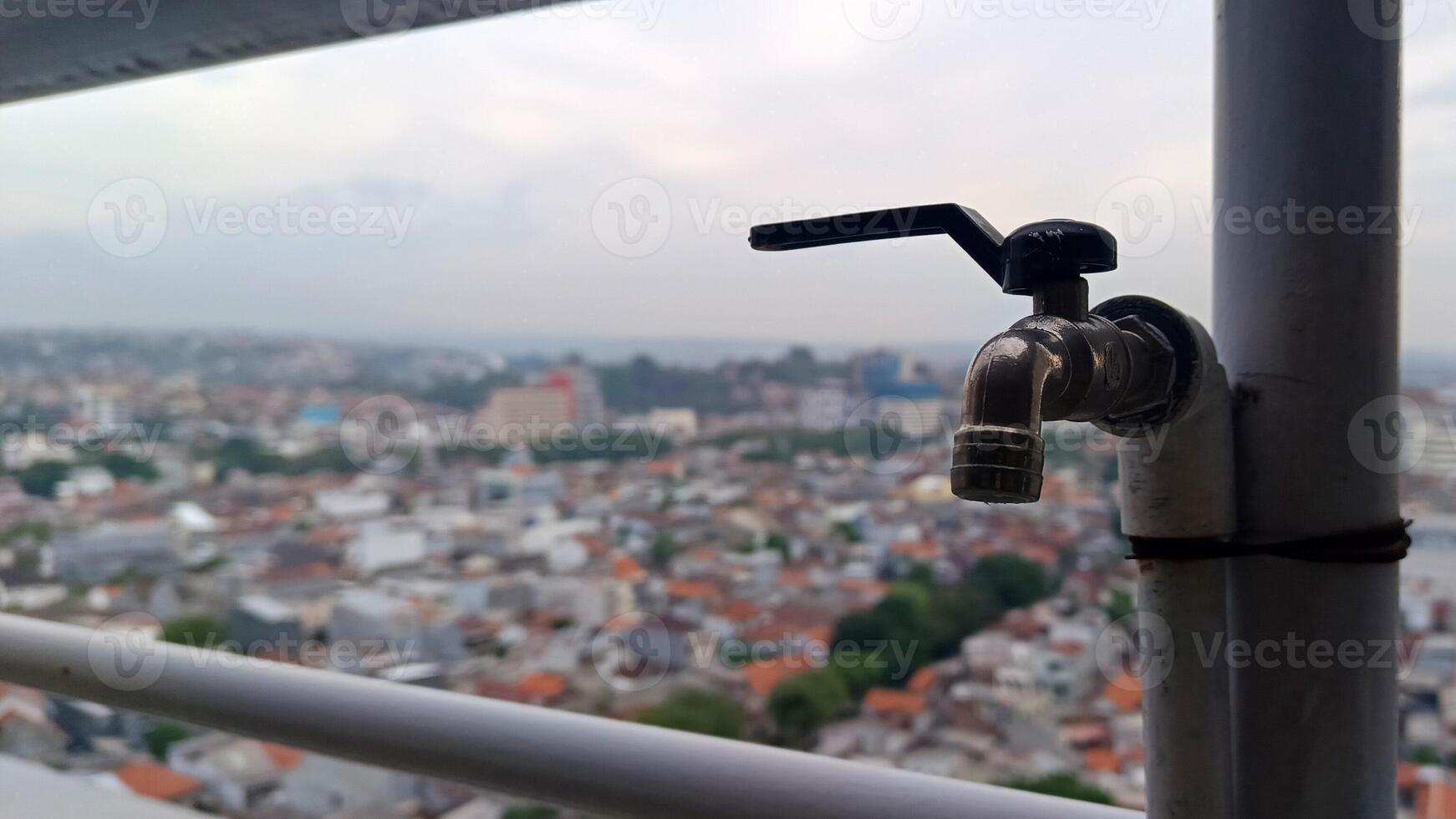 Close up view of outdoor water faucet photo