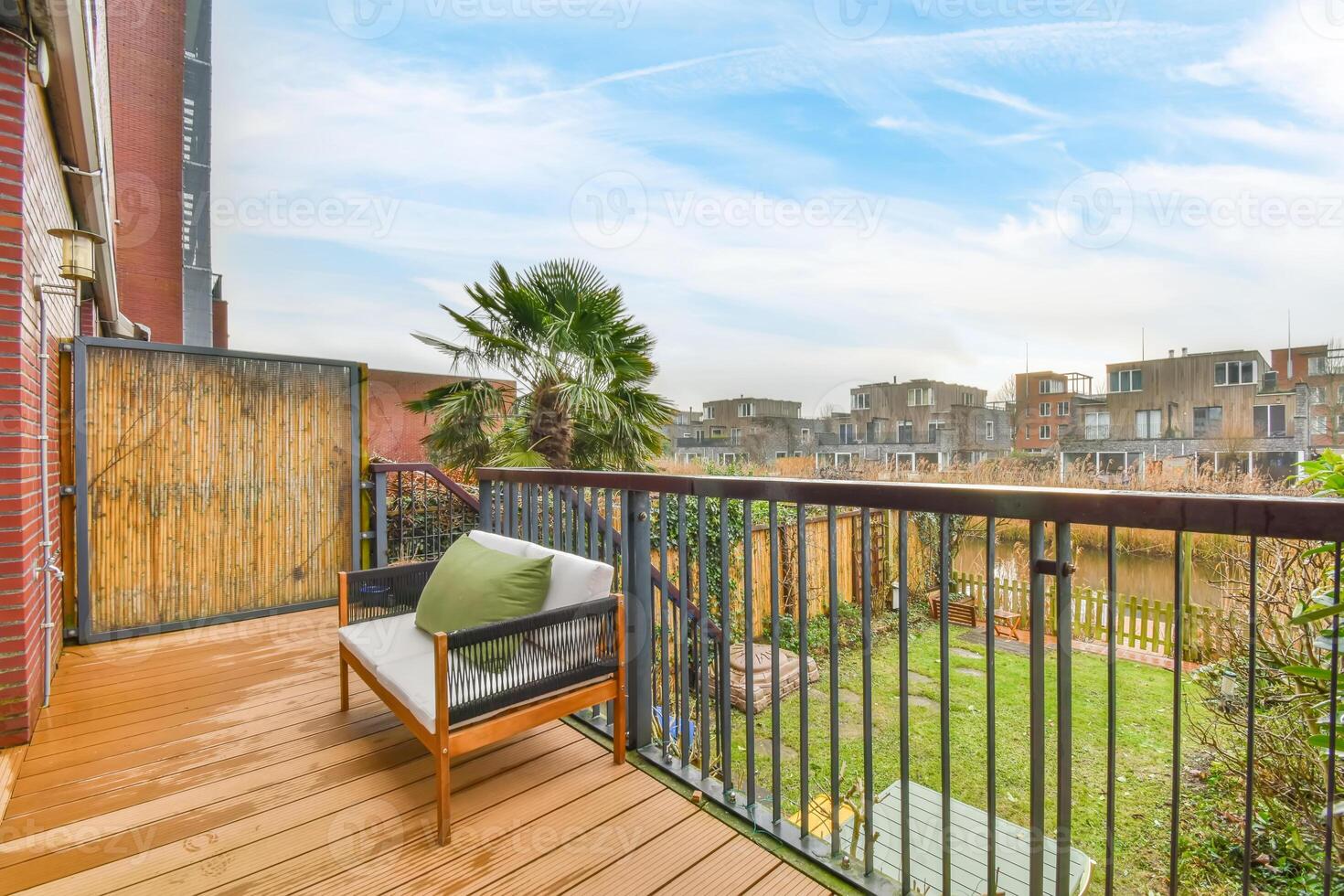 A wooden deck with a bench photo