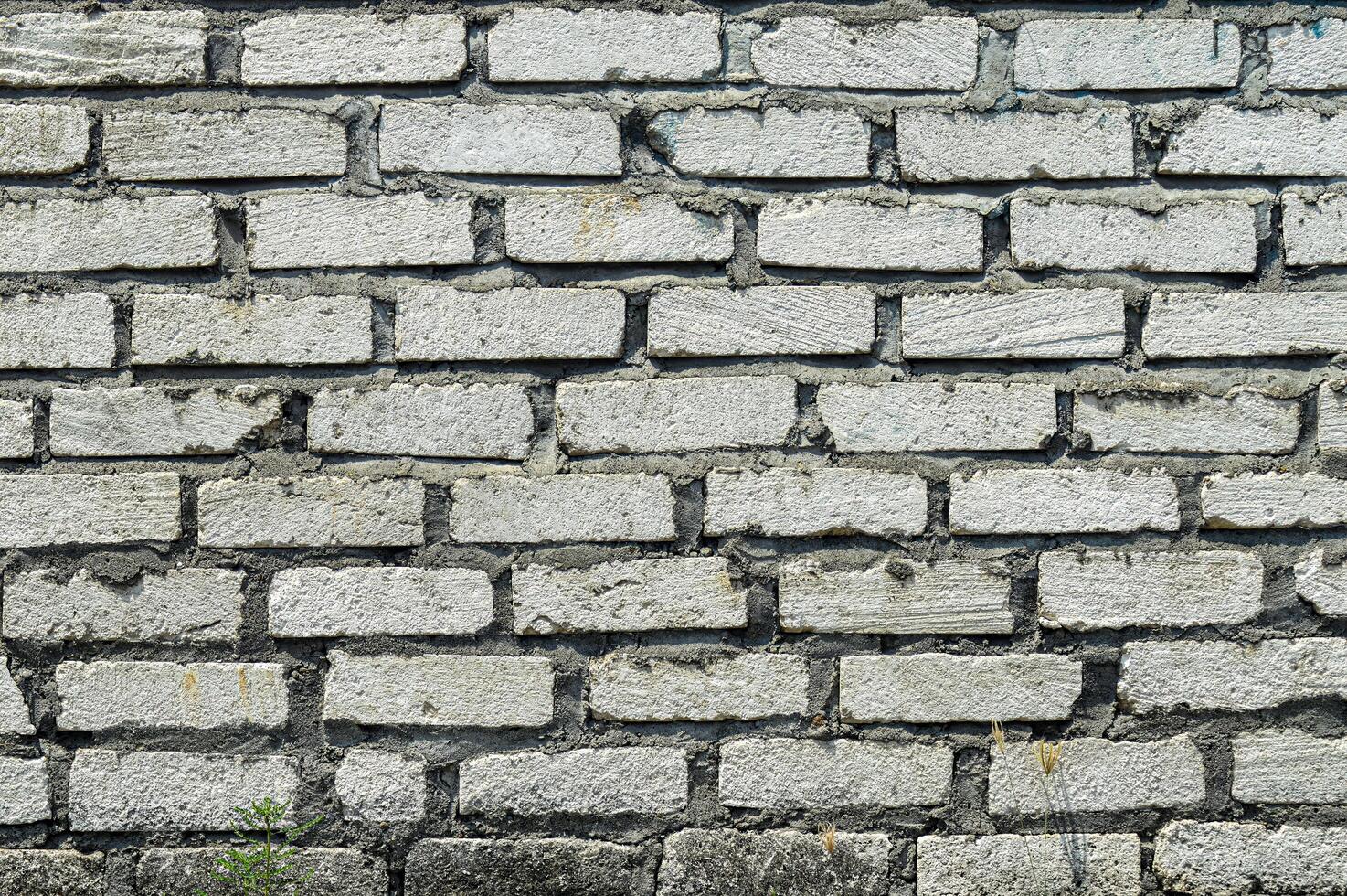 Gray brick wall with subtle color variations and natural patterns, perfect for backgrounds or design elements. photo
