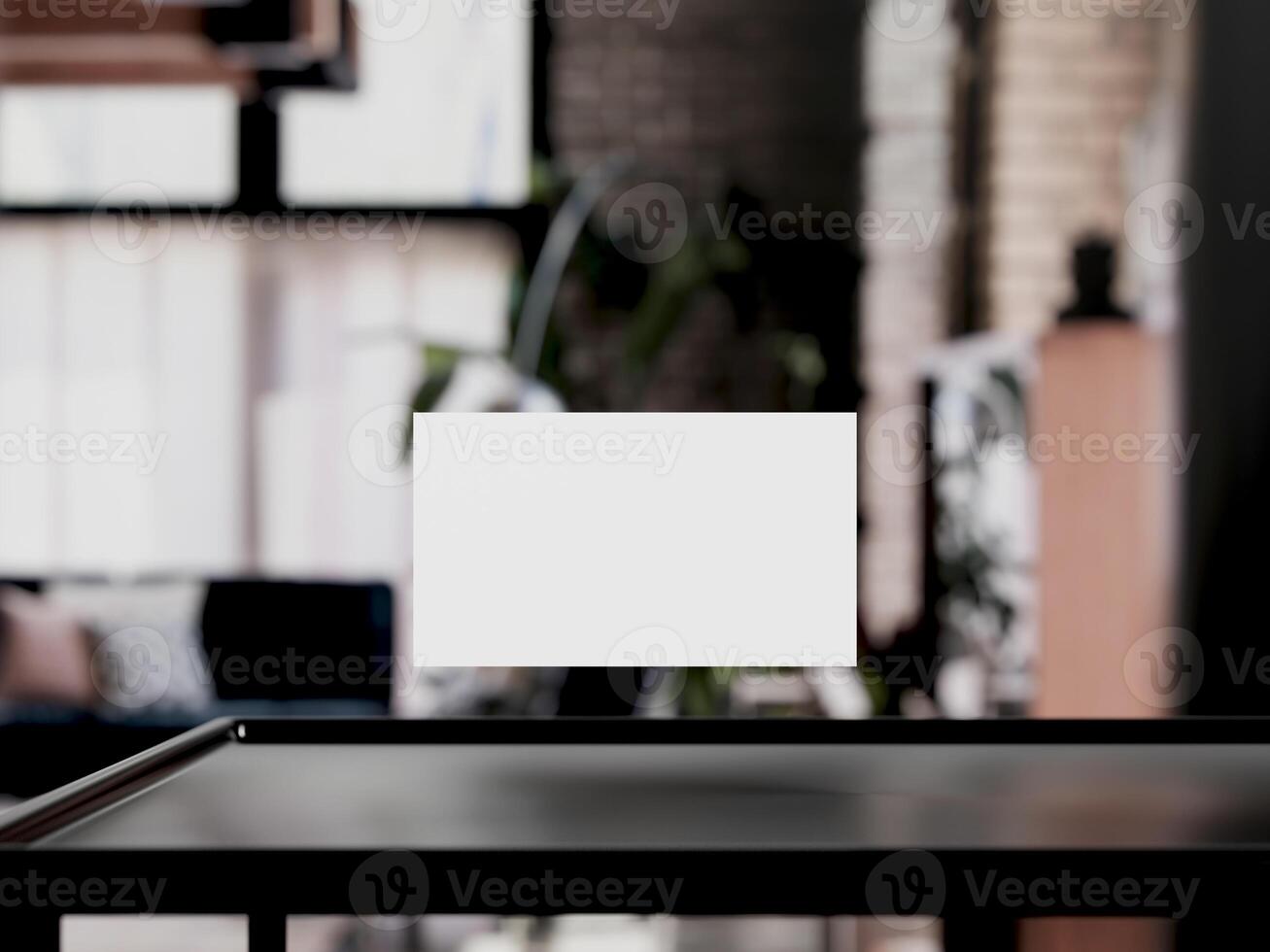 Clean minimal business card mockup on table with office background photo