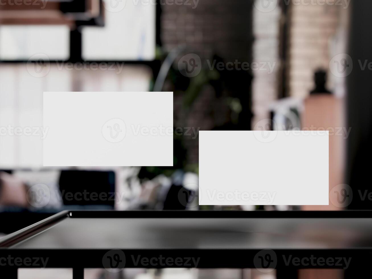 Clean minimal business card mockup on table with office background photo