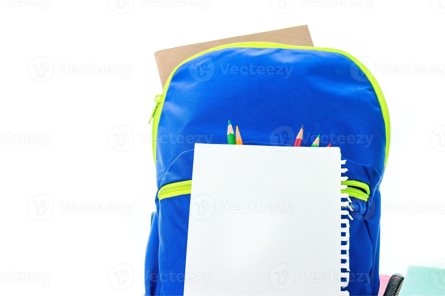 School backpack with pencils and notebook on white background photo