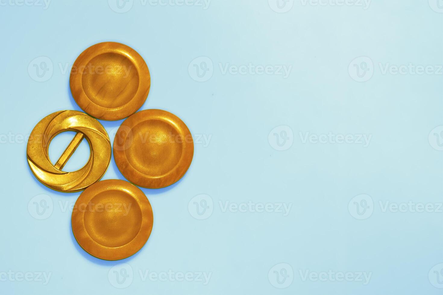 Light orange copper ginger wooden circles buttons on blue. Elements,decoration photo