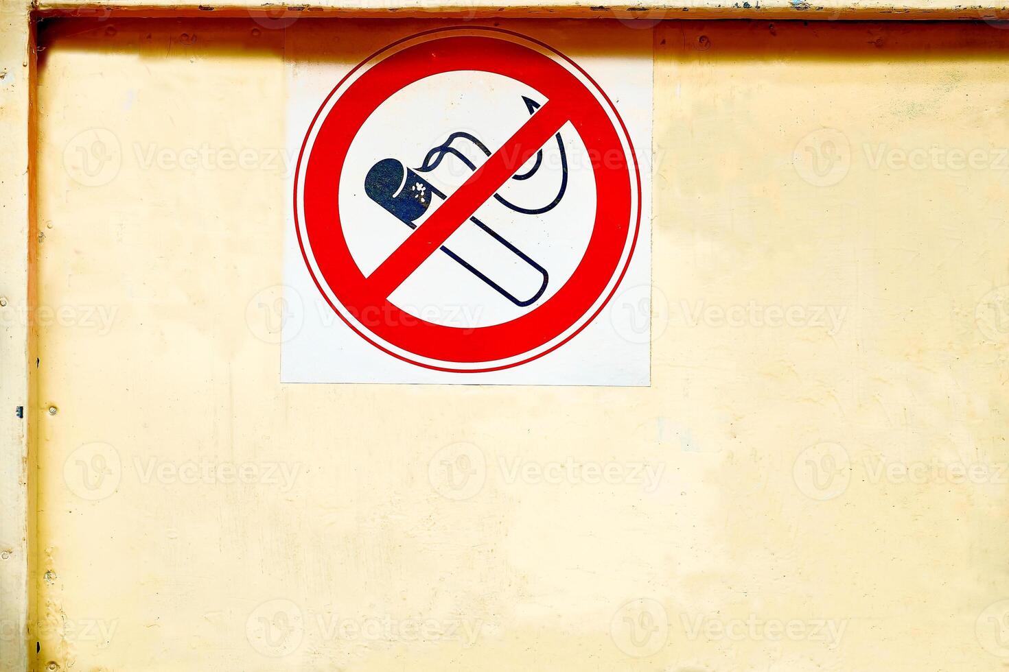 Prohibition sign no smoking on a dirty scratched wall photo