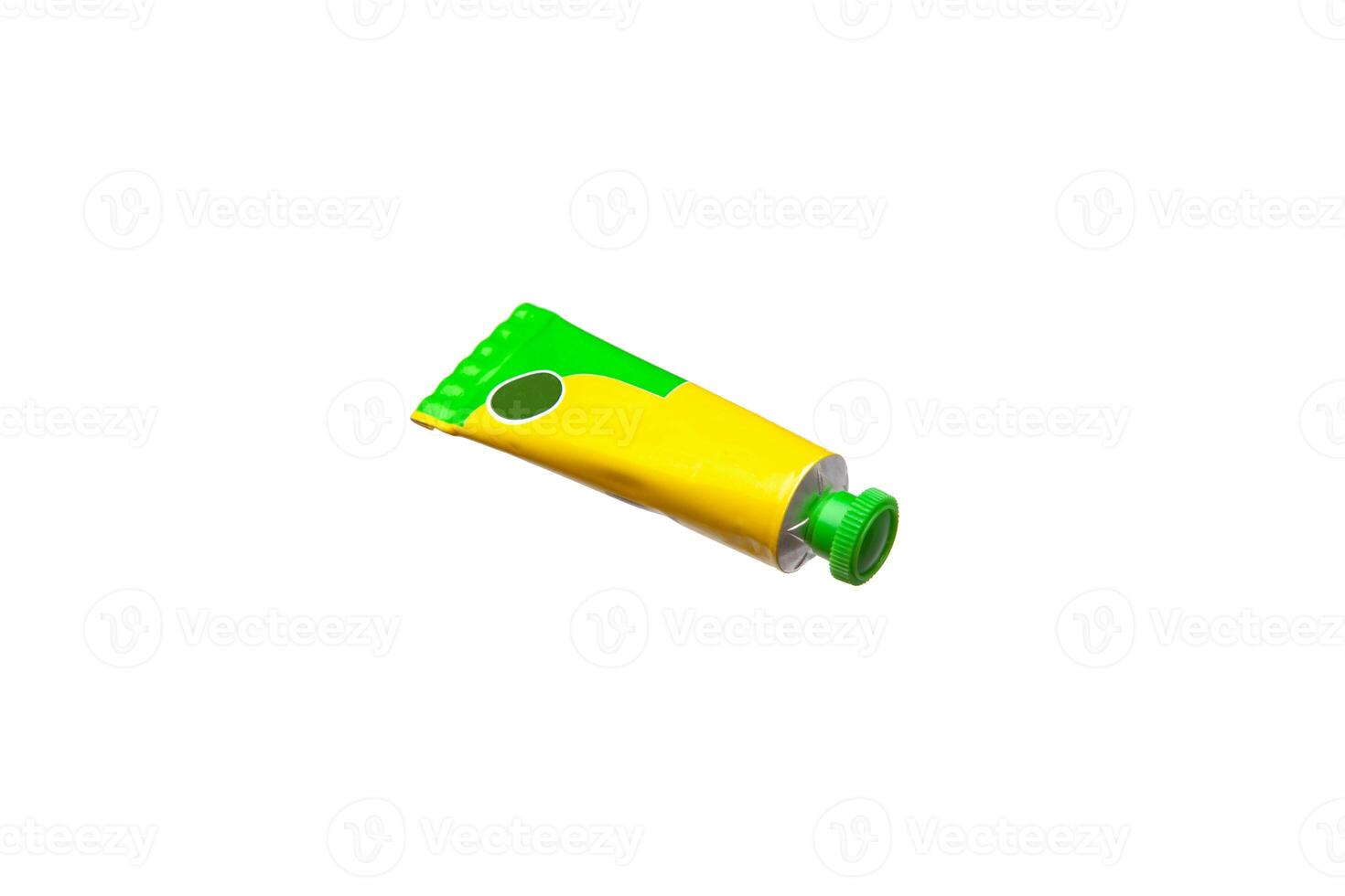 Yellow and green tube with a green cap, isolated on white background, ideal for product packaging mockups. photo