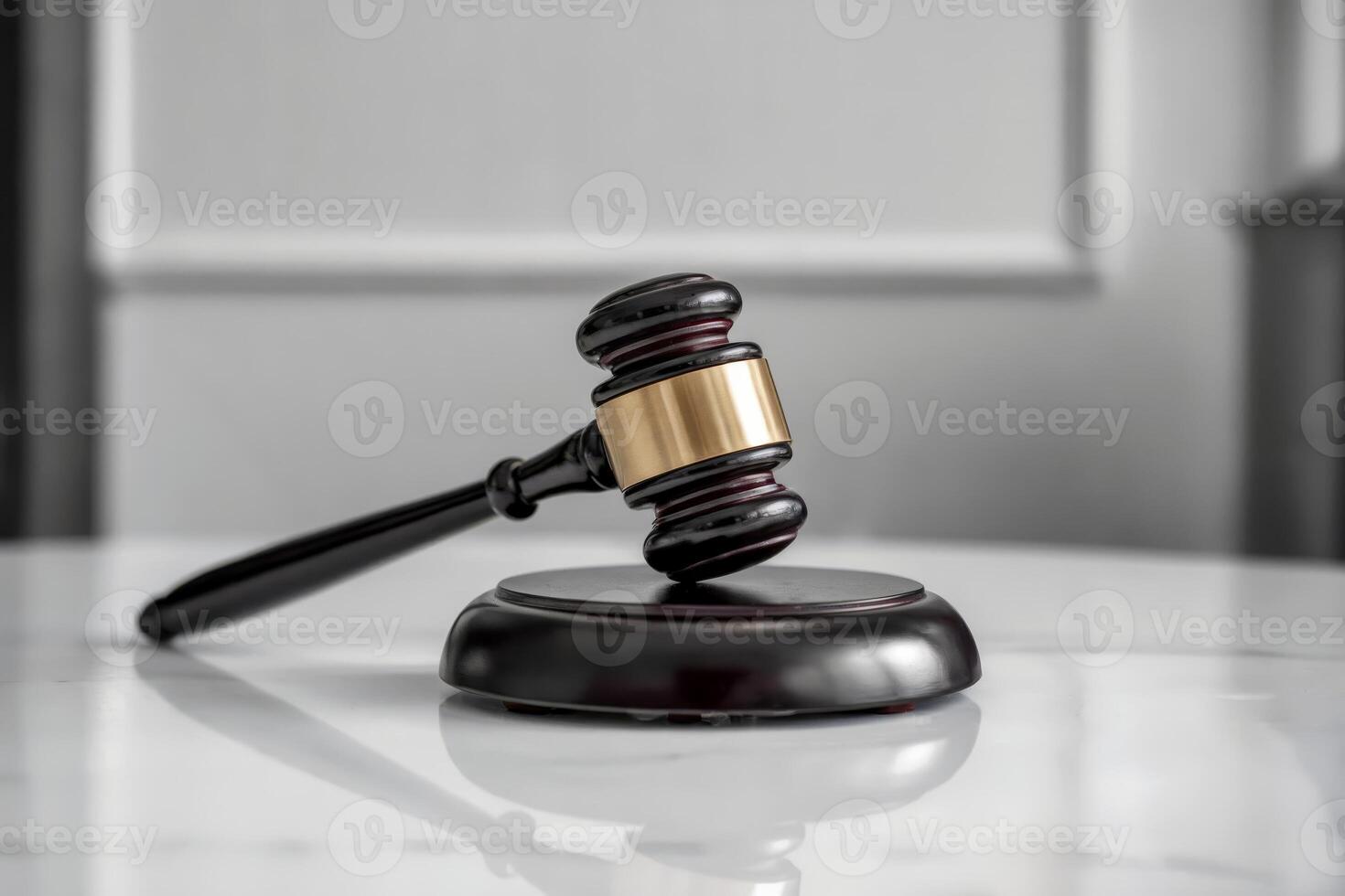 Wooden gavel on a sound block in a courtroom setting. photo