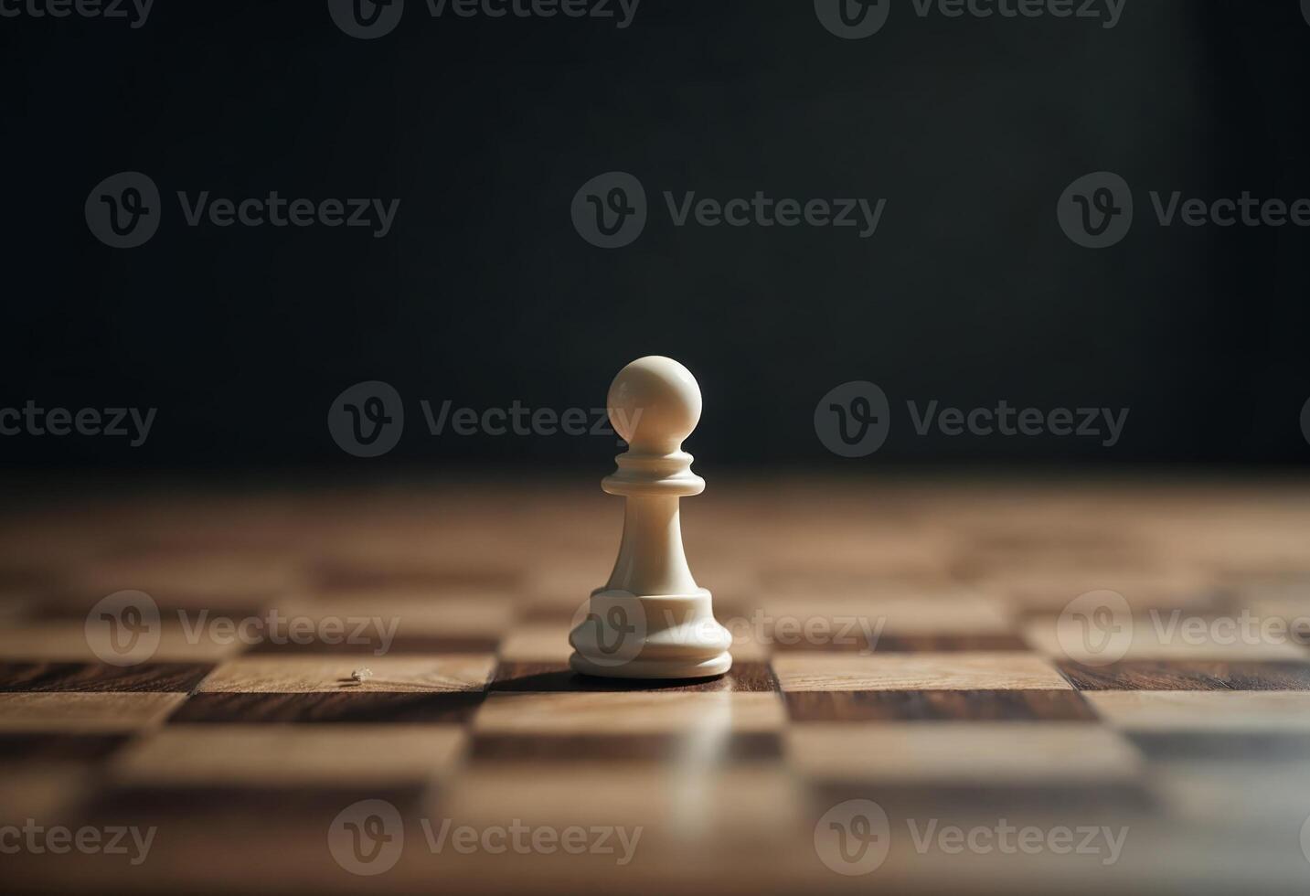 Lone white pawn on a wooden chessboard under focused lighting. photo
