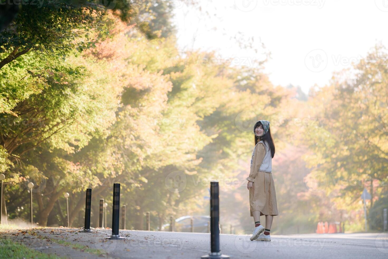Kyoto's fall beauty, Asian woman in a casual dress. Elegant portrait amid colorful maple foliage, capturing her cheerful smile and the refreshing vibe of the seasonal change. photo