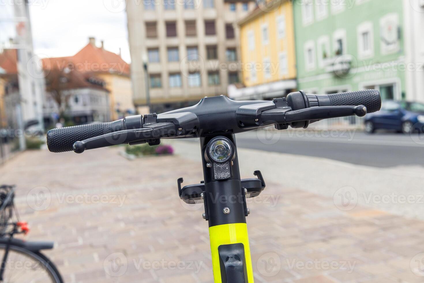 Electric scooter handlebars close-up in urban setting, transportation, technology concept photo