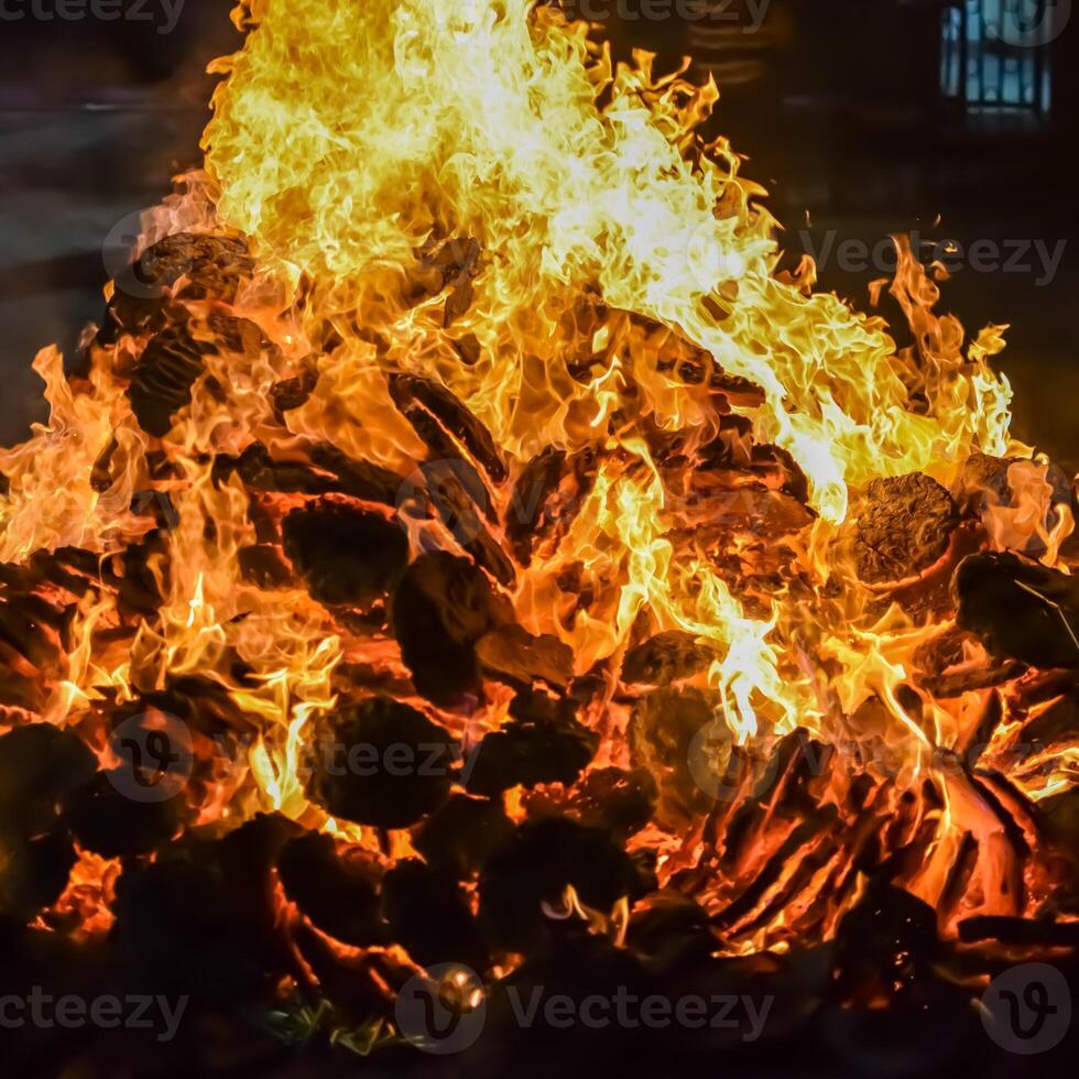 Fire flames on black background, Blaze fire flame texture background, Beautifully, the fire is burning, Fire flames with wood and cow dung bonfire photo