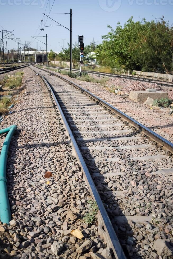 View of train Railway Tracks from the middle during daytime at Amritsar railway station in India, Train railway track view, Indian Railway junction, Heavy industry photo