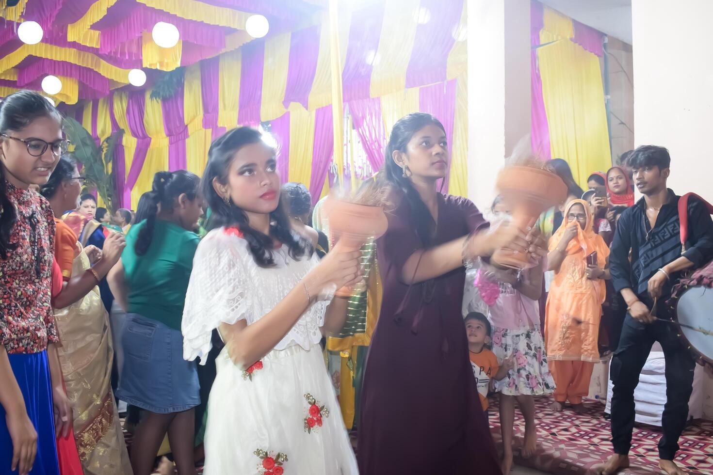 Delhi, India, July 02,2024 - Devotees performing spiritual dance in front of Durga Idol, Durga Puja celebration at Kali Bari temple in Jhilmil Colony Delhi, Durga utsav festival in Oct 2023 photo