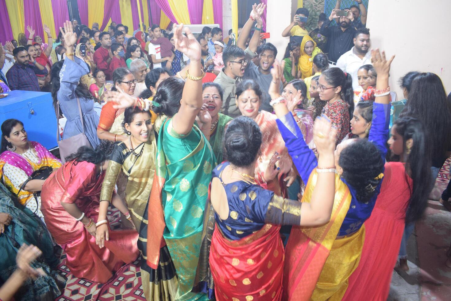 Delhi, India, July 02,2024 - Devotees performing spiritual dance in front of Durga Idol, Durga Puja celebration at Kali Bari temple in Jhilmil Colony Delhi, Durga utsav festival in Oct 2023 photo