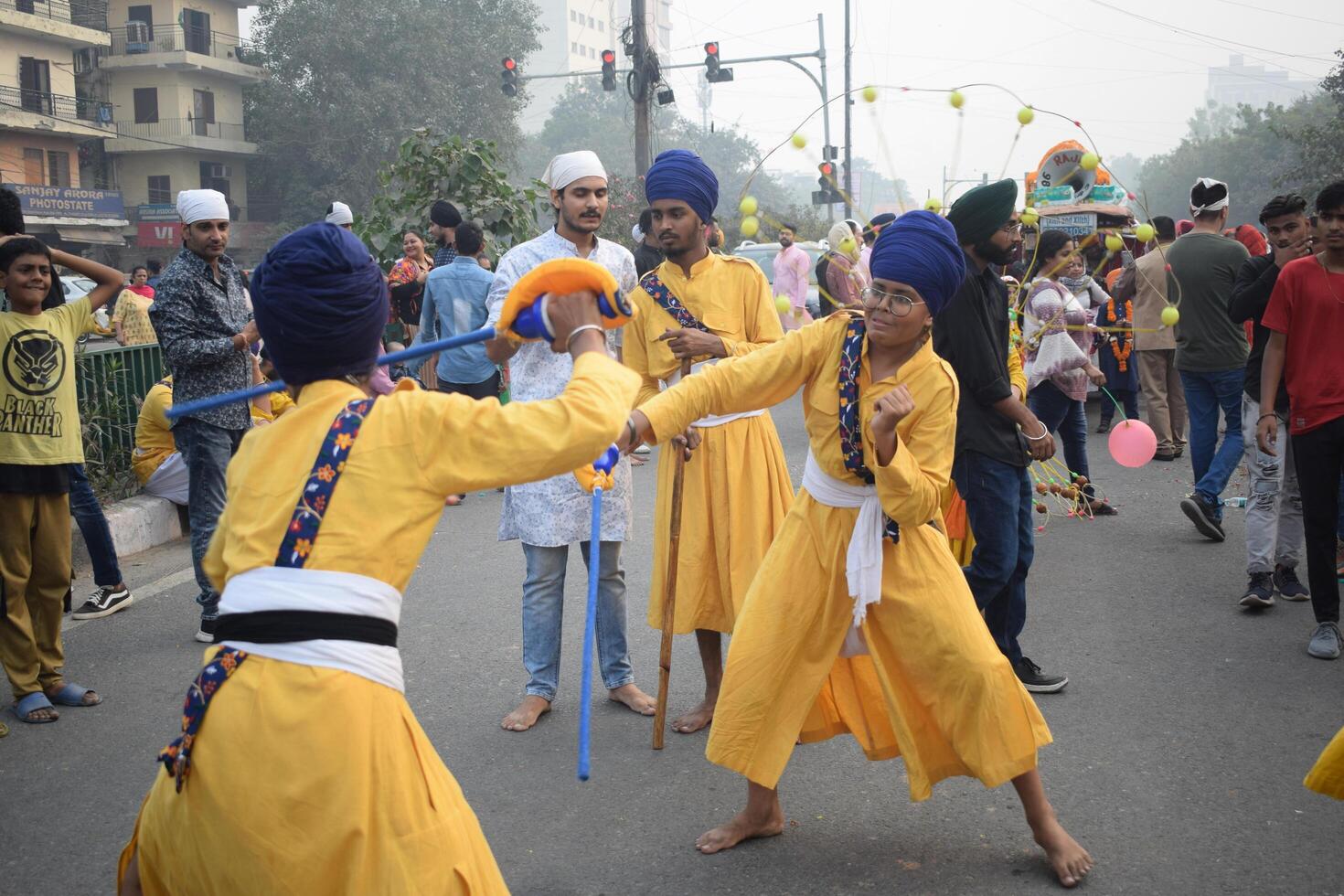 Delhi, India, August 15, 2024 - Sikhs display gatka and martial arts during annual Nagar Kirtan, Traditional, procession on account of birthday of Guru Nanak Dev ji, Nagar Kirtan in East Delhi area photo