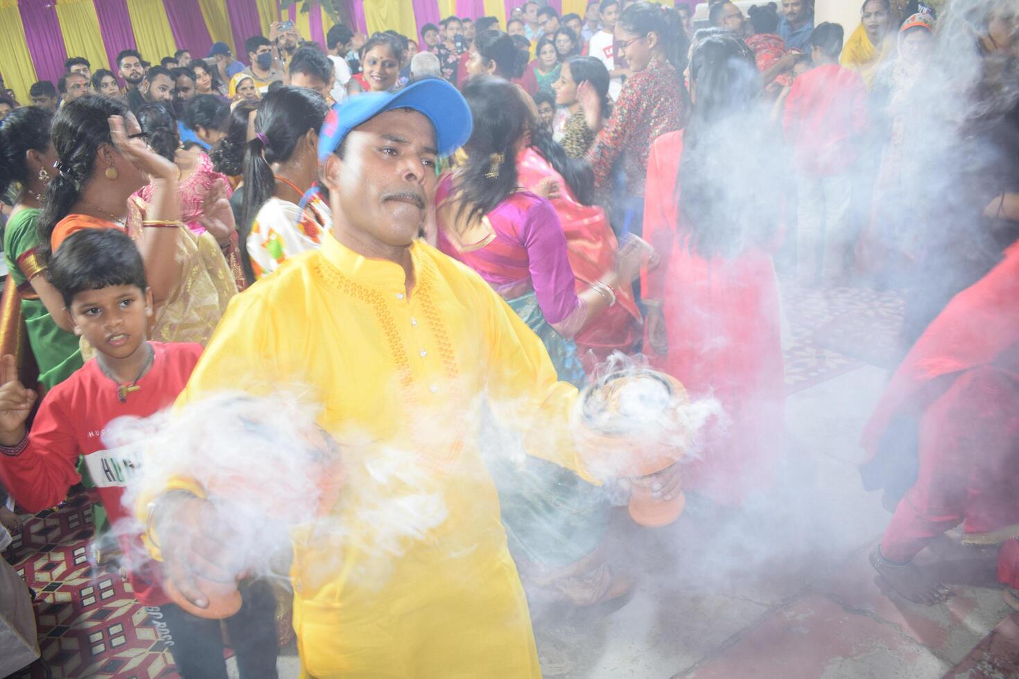 Delhi, India, July 02,2024 - Devotees performing spiritual dance in front of Durga Idol, Durga Puja celebration at Kali Bari temple in Jhilmil Colony Delhi, Durga utsav festival in Oct 2023 photo