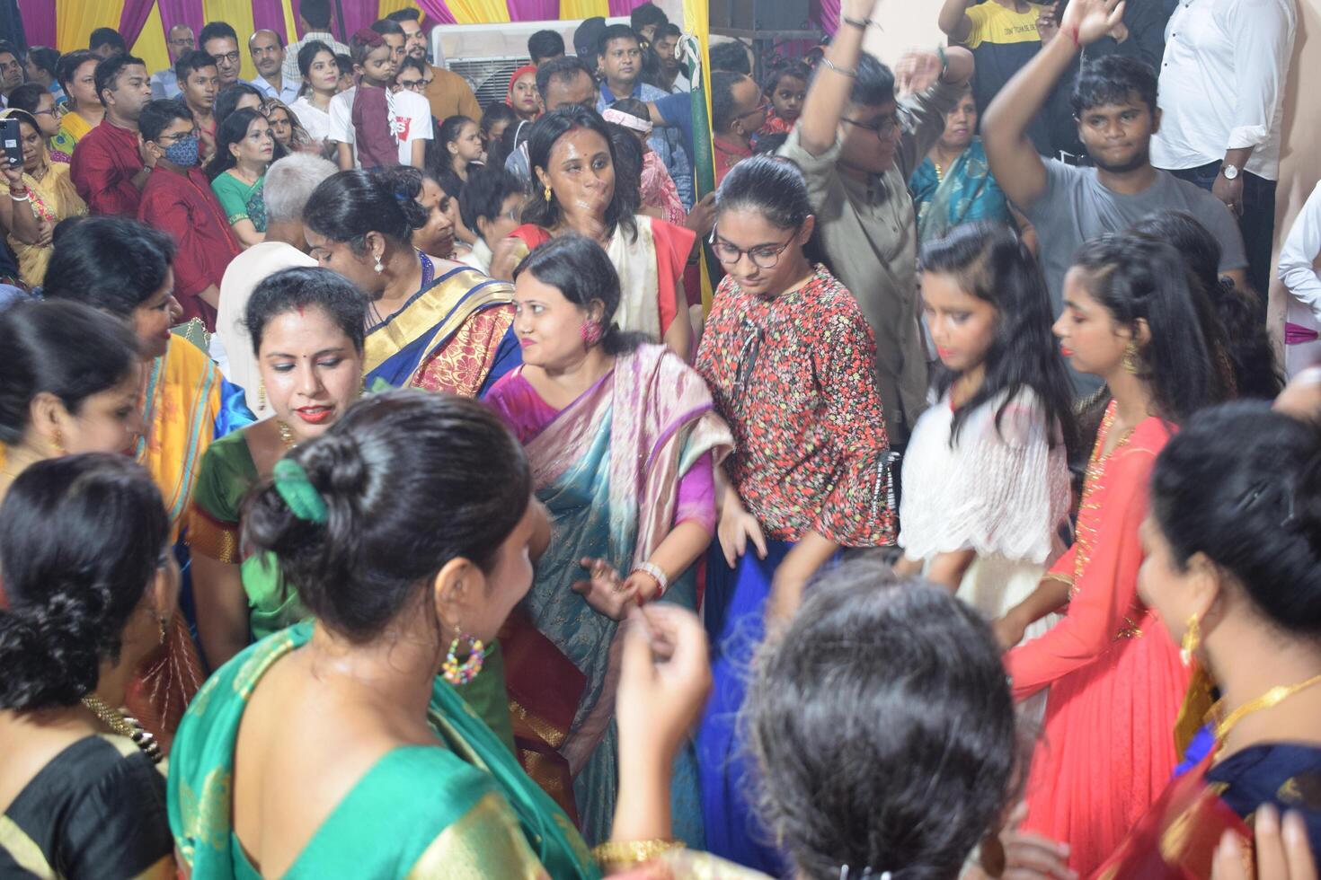 Delhi, India, July 02,2024 - Devotees performing spiritual dance in front of Durga Idol, Durga Puja celebration at Kali Bari temple in Jhilmil Colony Delhi, Durga utsav festival in Oct 2023 photo